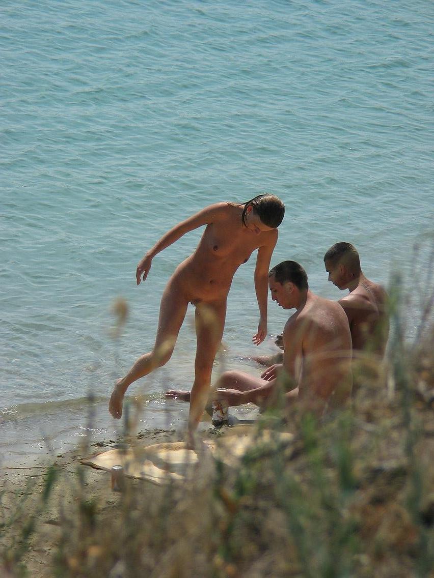 15P Slim teen with perky boobs naked at a nudist beach