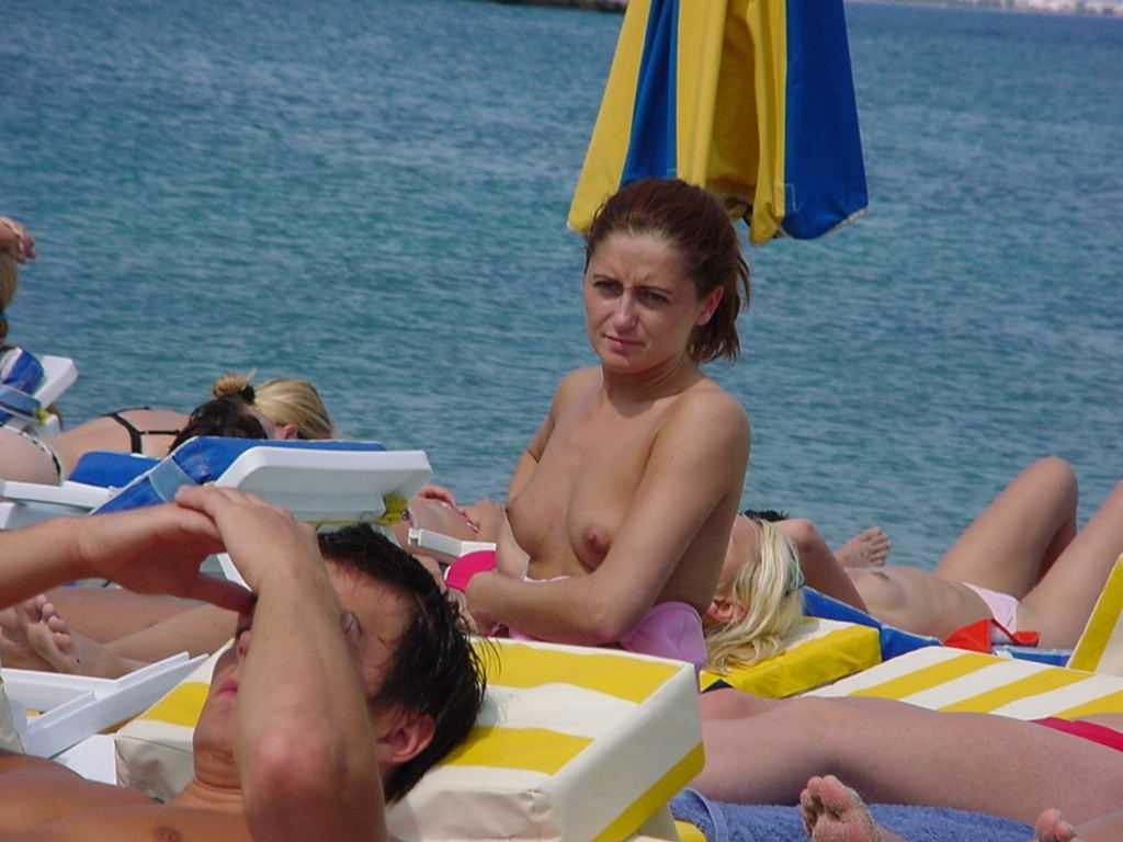 15P Barely legal young nudist lays naked at the beach