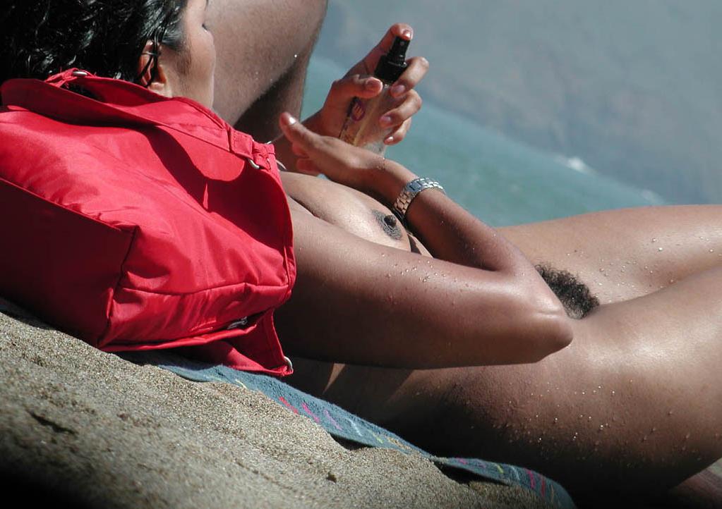 15P Barely legal young nudist lays naked at the beach