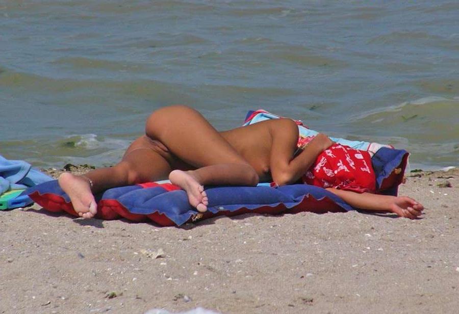 15P Barely legal young nudist lays naked at the beach