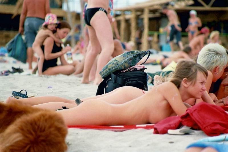 15P Barely legal young nudist lays naked at the beach