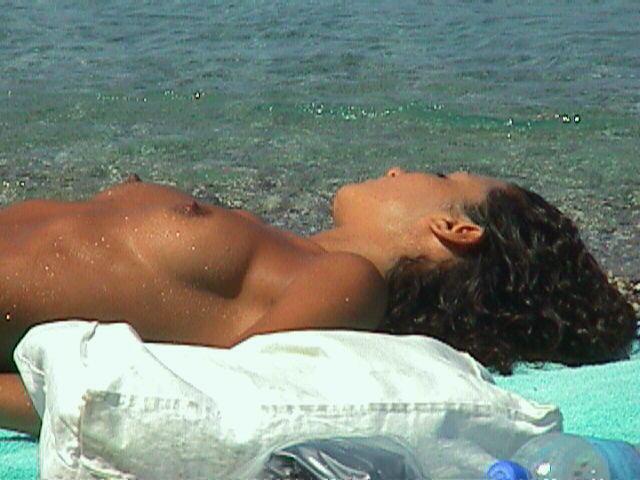 15P Public beach just got hotter with a busty nudist