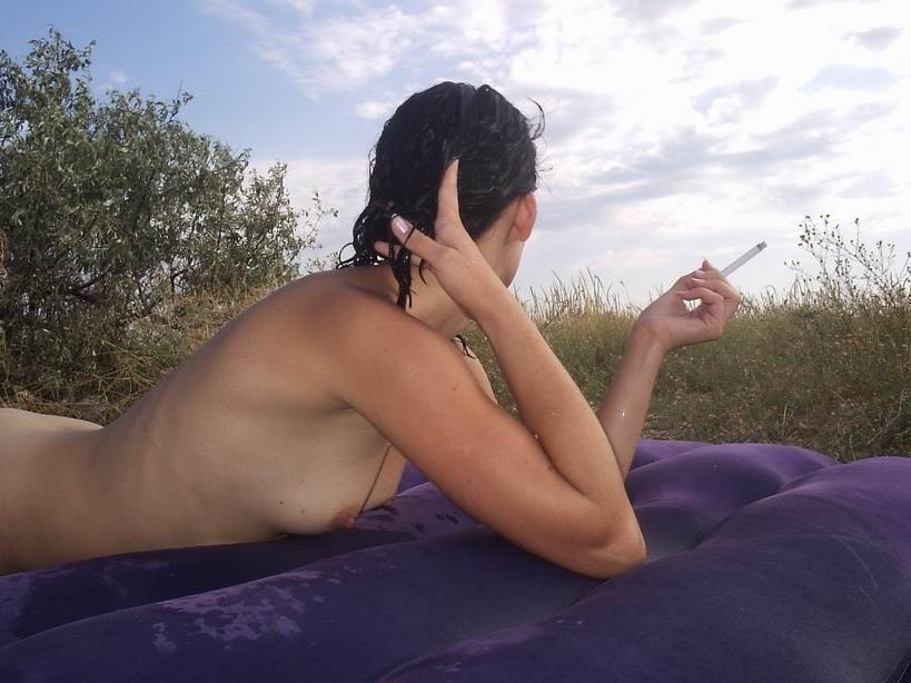 15P Perky breasted beach babe shows off her nude body