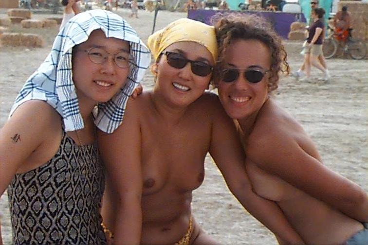 15P Perky breasted beach babe shows off her nude body