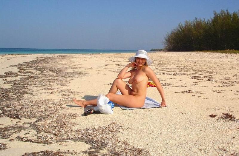 15P Perky breasted beach babe shows off her nude body