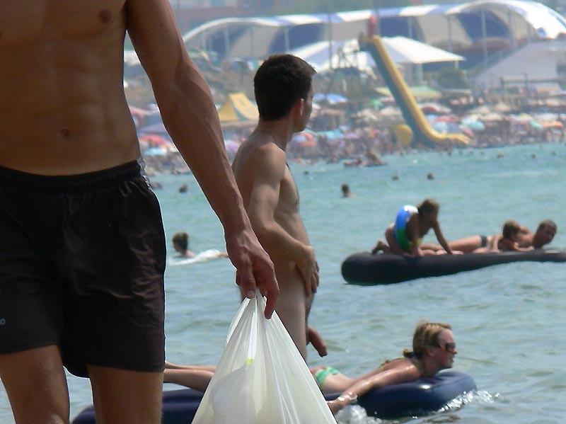 15P Nudist babes have fun with each other at the beach