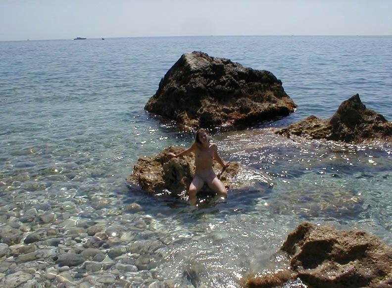 15P Pin up teen shows off her body at the nude beach