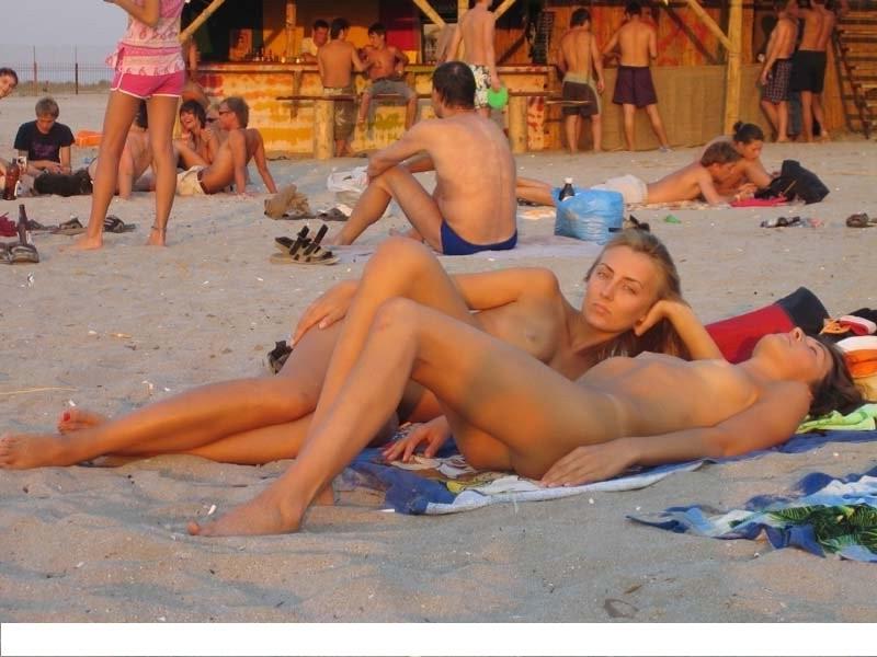 15P At the nudist beach teen girls play around naked