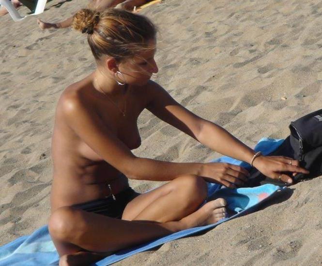 15P Blonde has some fun being nude on a public beach