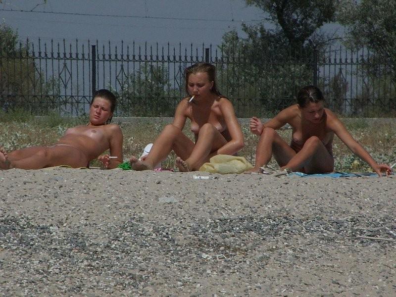 15P Slim teen with perky boobs naked at a nudist beach