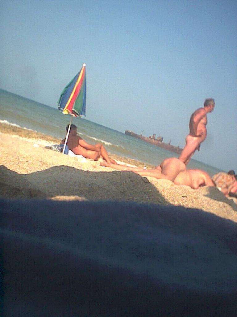 15P Friendly young Russian nudists lay on the beach