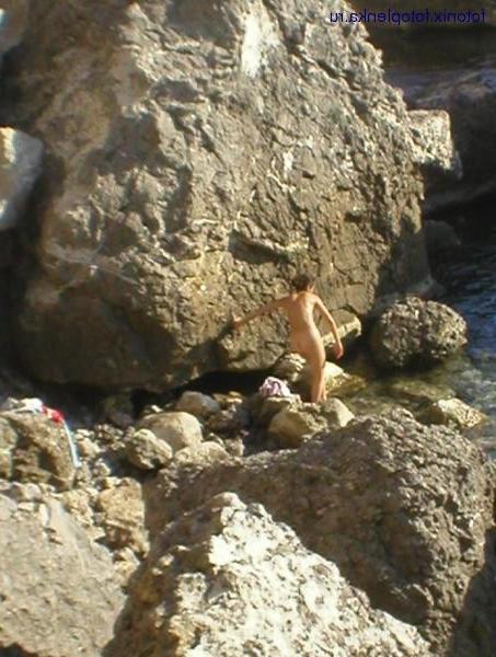 15P Friendly young Russian nudists lay on the beach