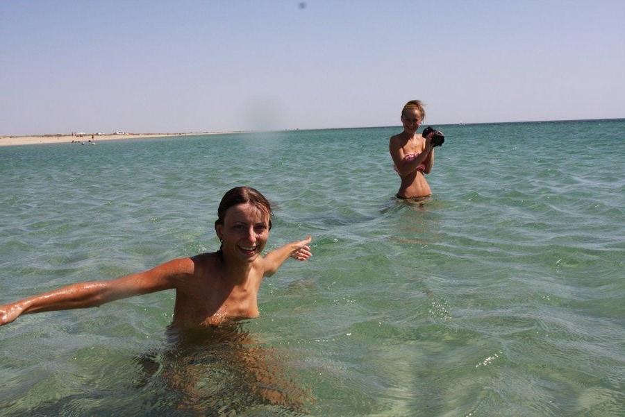 15P Barely legal young nudist lays naked at the beach