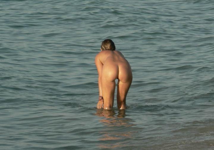 15P Barely legal young nudist lays naked at the beach