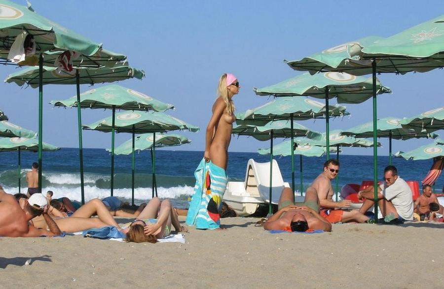 15P Barely legal young nudist lays naked at the beach