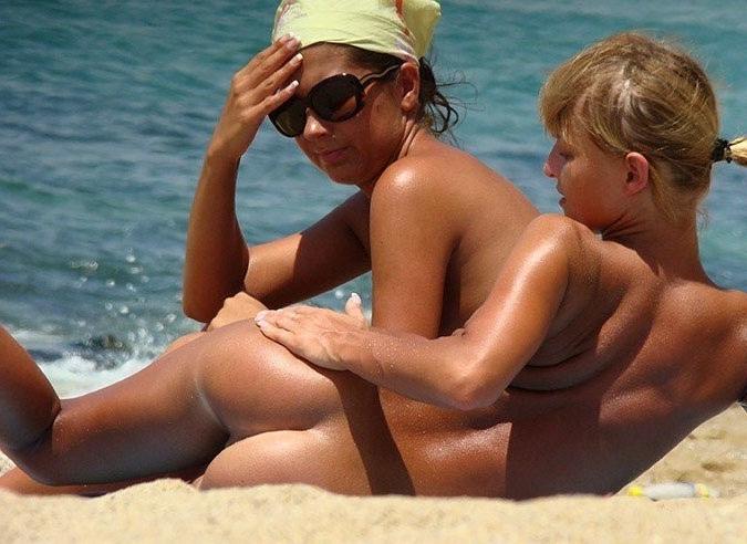 15P Friendly young Russian nudists lay on the beach