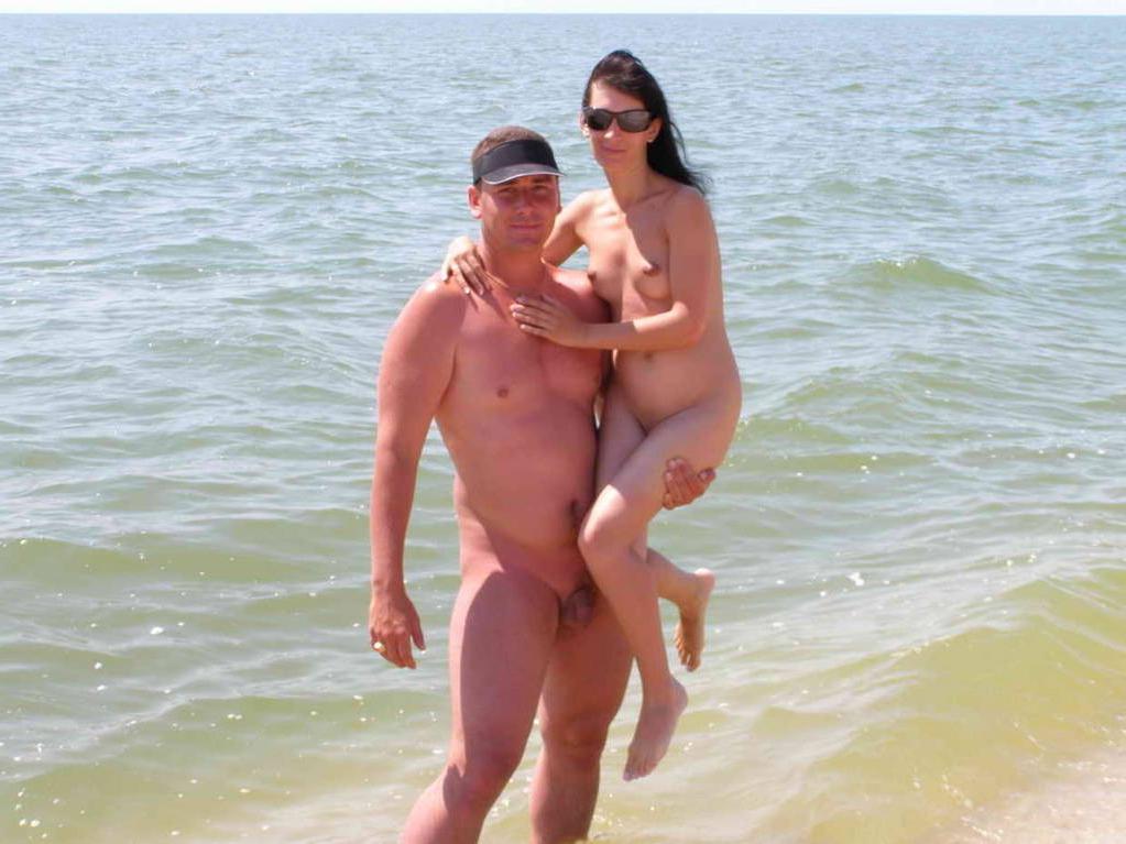 15P Friendly young Russian nudists lay on the beach