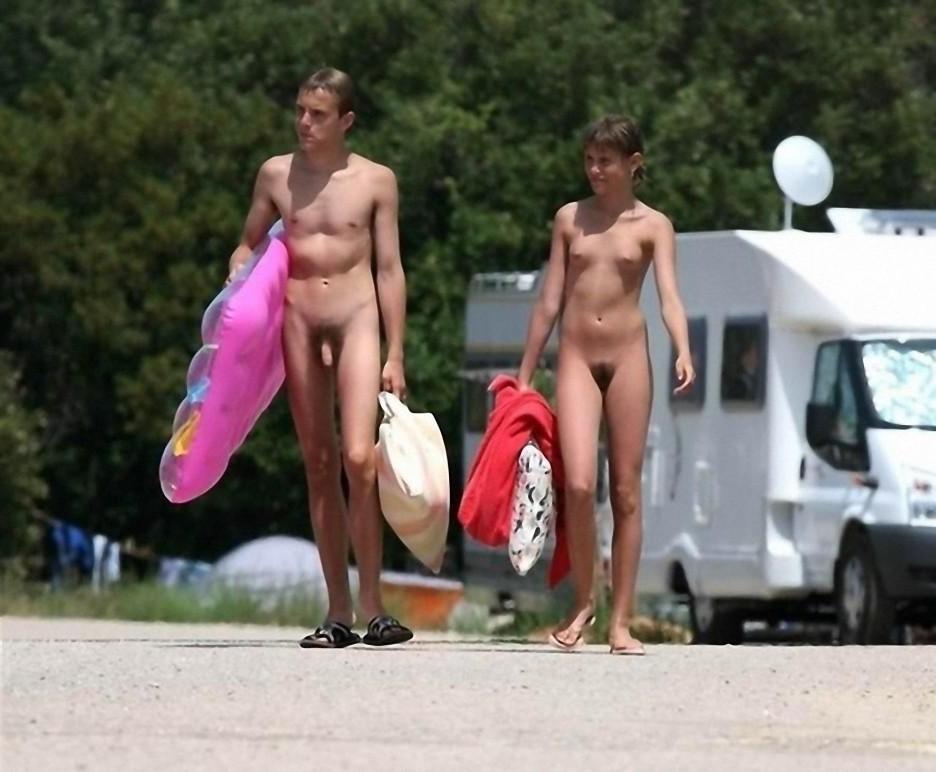 15P Two nudist friends get an even tan at the beach