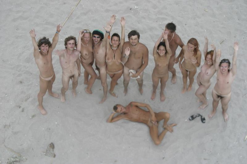 15P Blonde nudist strips down naked at a public beach