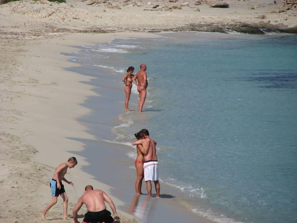 15P Wild naked chick has a great time at a nude beach