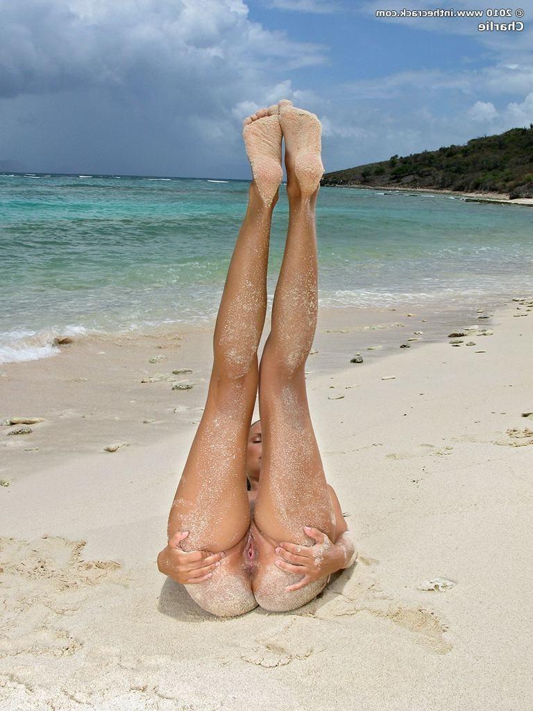 15P Cute babe spreads sand covered ass and pussy close up on beach