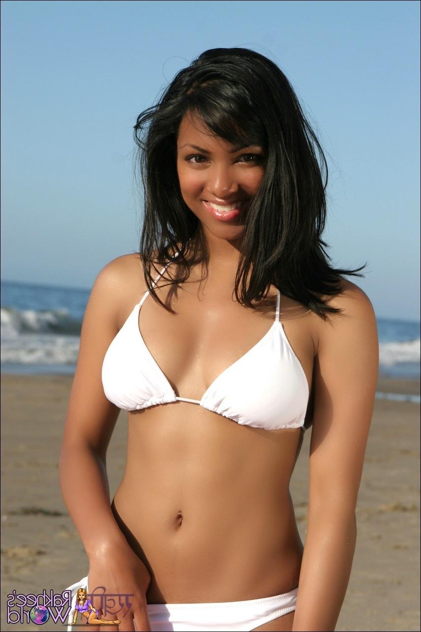 15P Sexy Indian teen on the beach in a bikini takes off her top