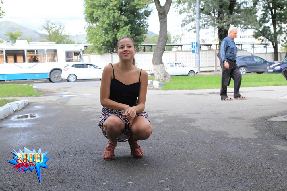 16P Chick squats down to show shes got no panties on