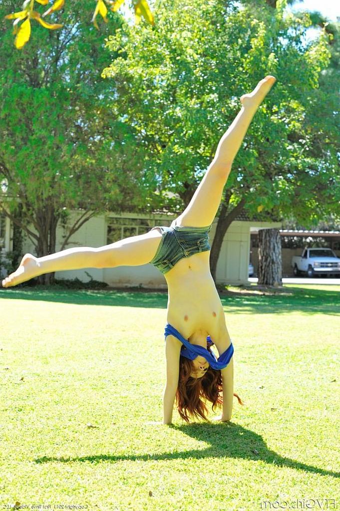15P Cute redhead does pussy flashing cartwheels in park