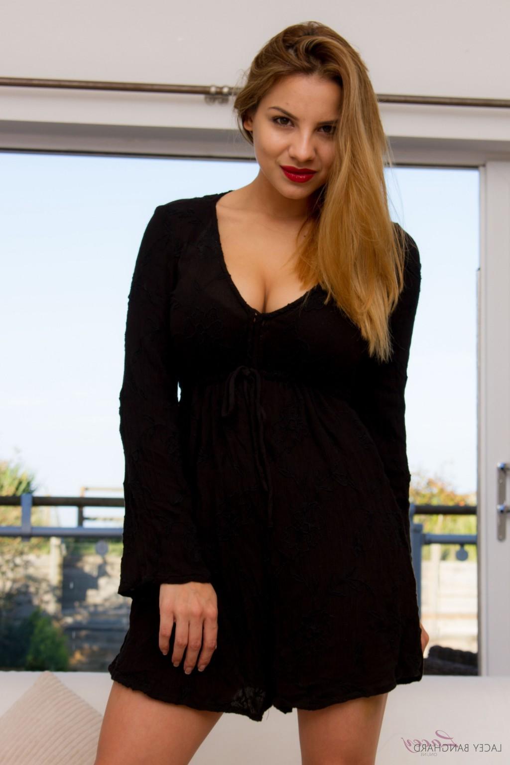 12P Stunning Lacey Banghard stripping in front of a window