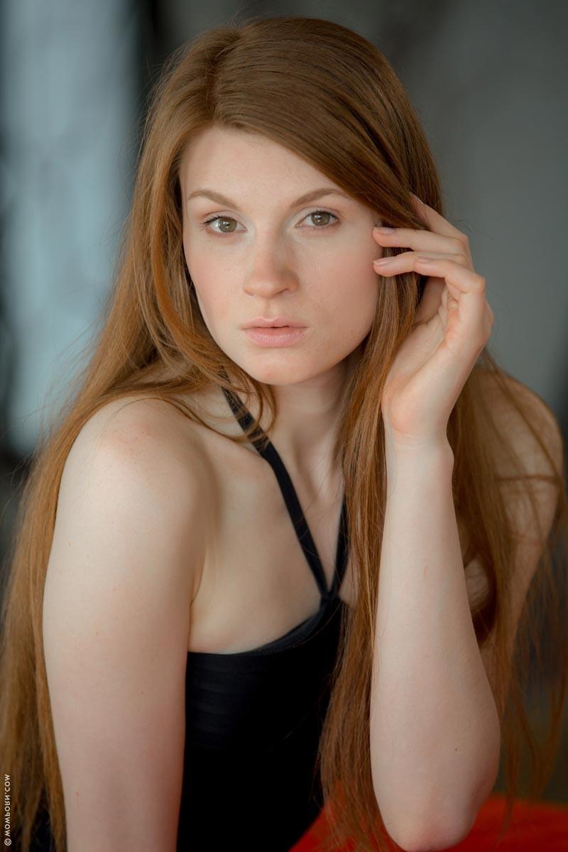 15P Cute slim redhead naked on sofa