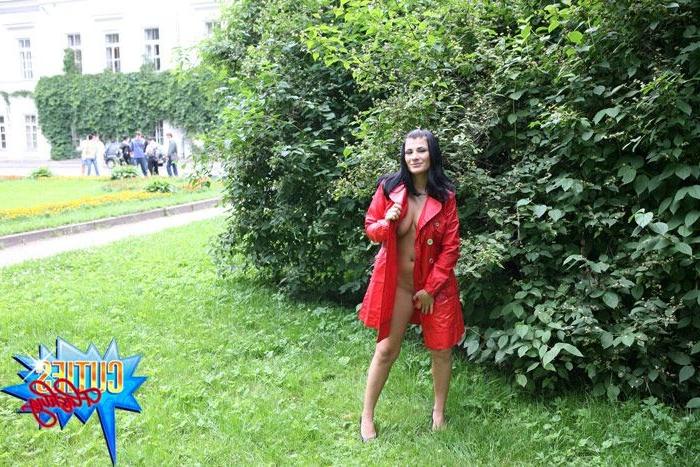 16P Sexual brunette girl in red leather coat flashing in the park