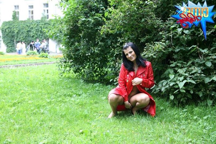 16P Sexual brunette girl in red leather coat flashing in the park
