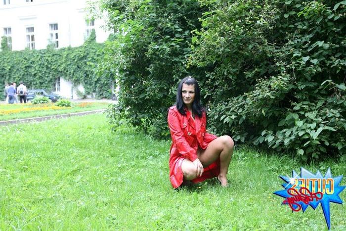 16P Sexual brunette girl in red leather coat flashing in the park