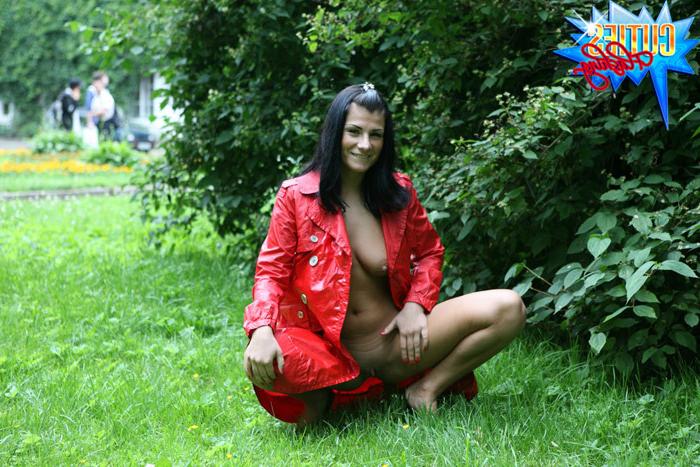 16P Sexual brunette girl in red leather coat flashing in the park