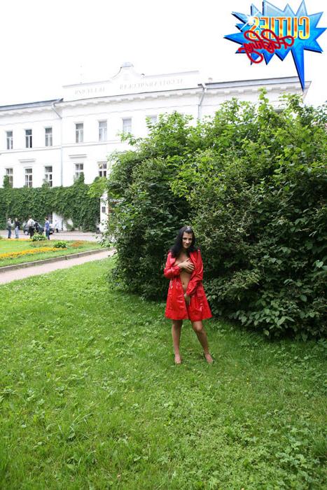 16P Sexual brunette girl in red leather coat flashing in the park