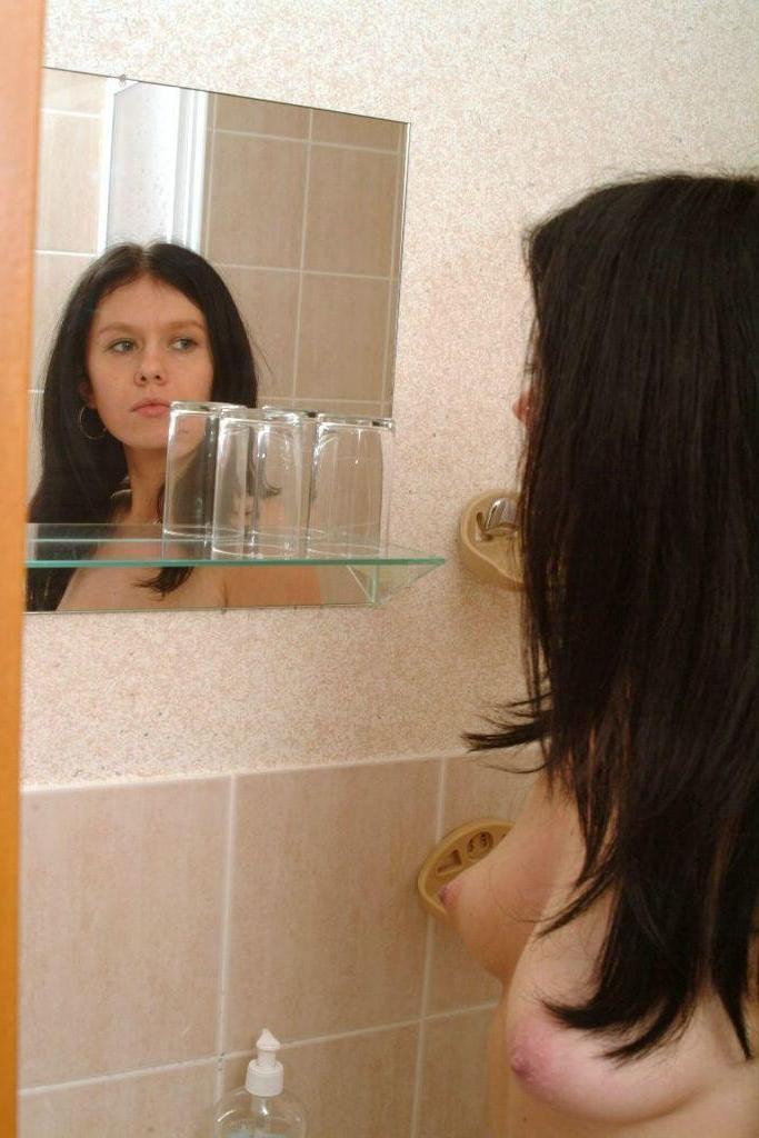 20P Pissing babe spreads her hairy pussy while teasing