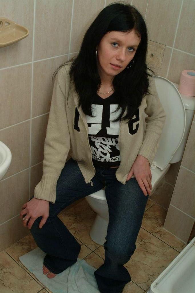 20P Pissing babe spreads her hairy pussy while teasing