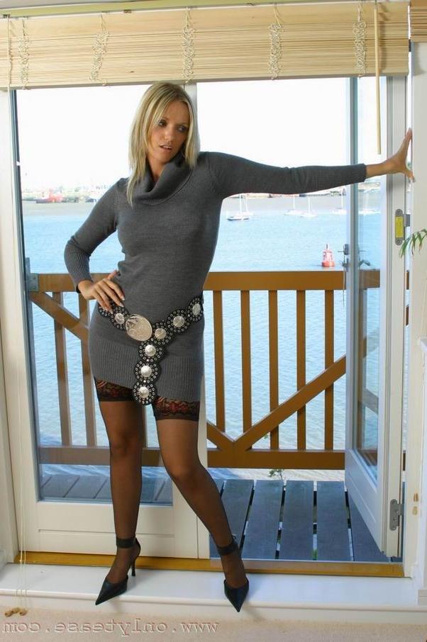 16P Blonde in armchair teasing with her sexy legs
