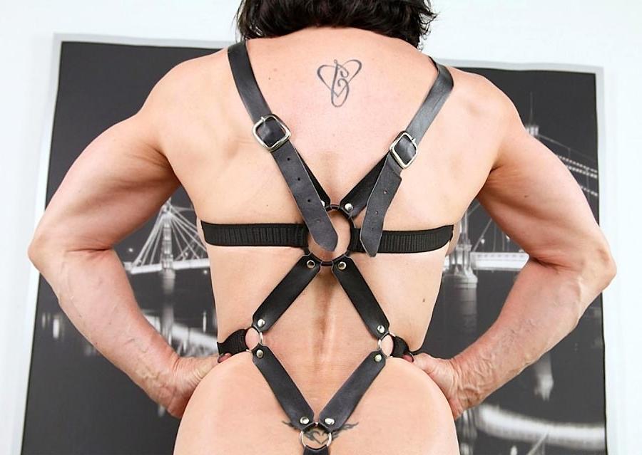 12P Mature muscle Mistress Jillian Fox posing in leather bondage