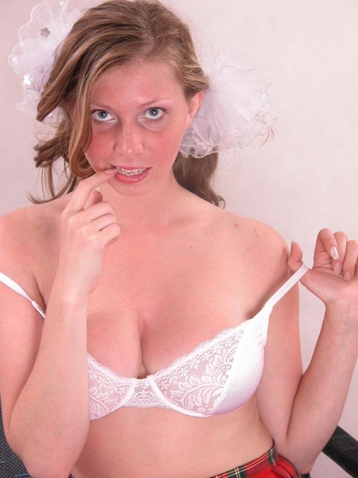16P Hot brunette schoolgirl with big tits stripping