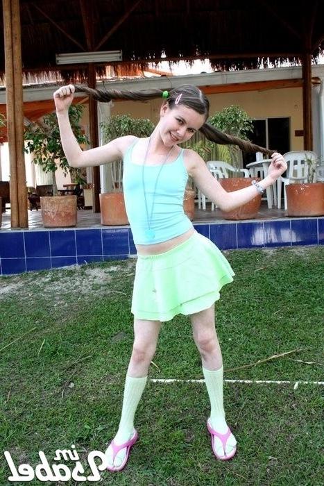 16P Small teen girl in short skirt and pigtails