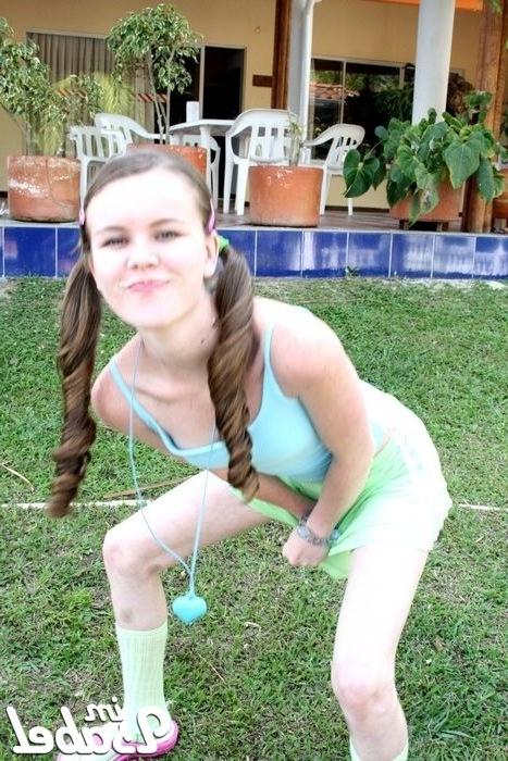 16P Small teen girl in short skirt and pigtails