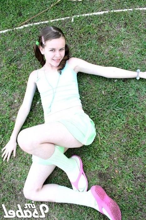 16P Small teen girl in short skirt and pigtails