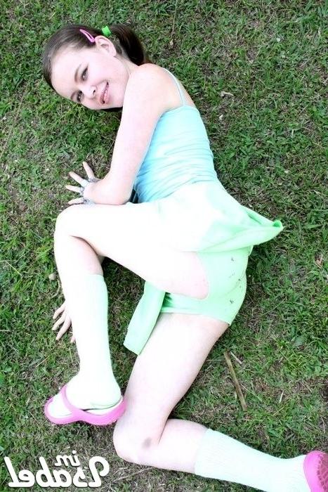 16P Small teen girl in short skirt and pigtails