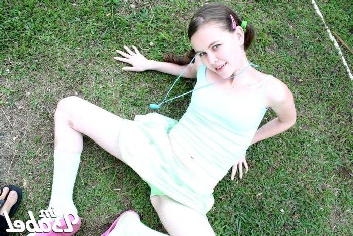 16P Small teen girl in short skirt and pigtails