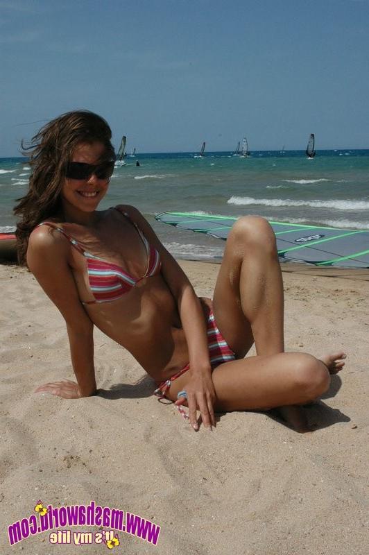 15P Young teen posing at the beach