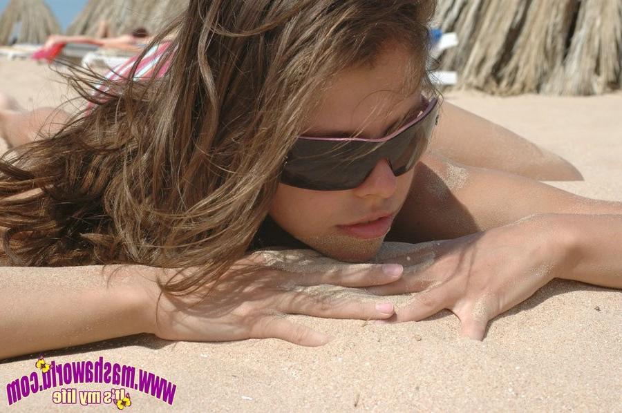 15P Young teen posing at the beach
