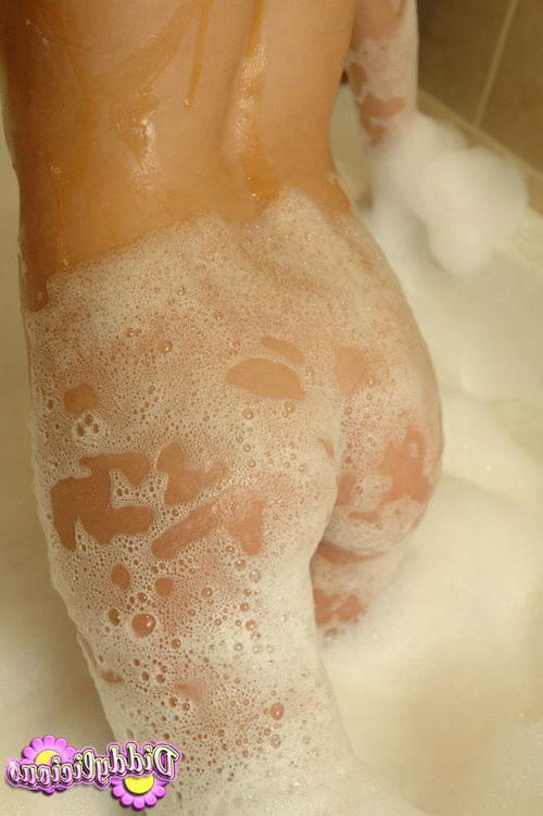 17P Young beautiful coed taking a hot bath in front of the camera