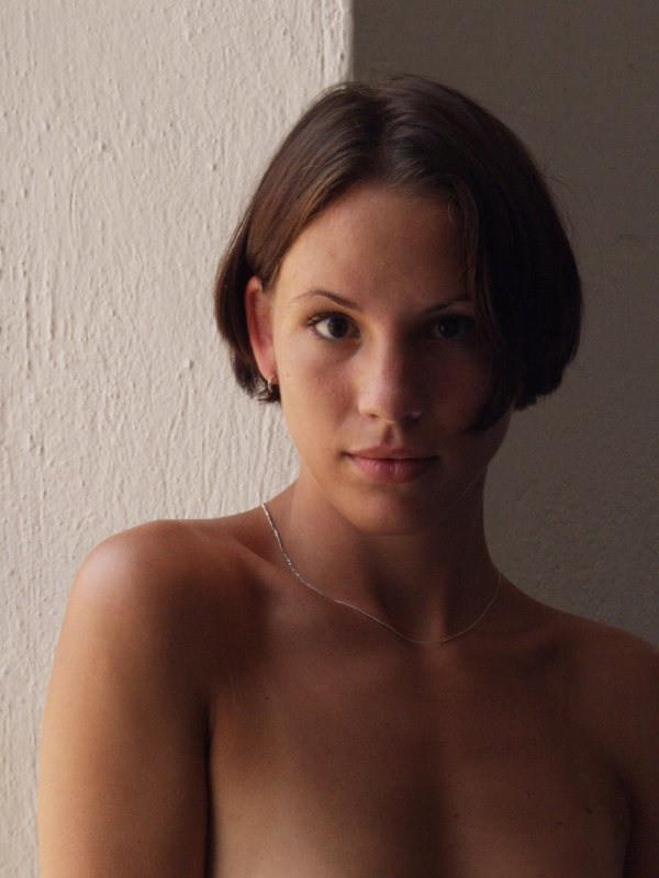 20P Teen showing angelic body by window