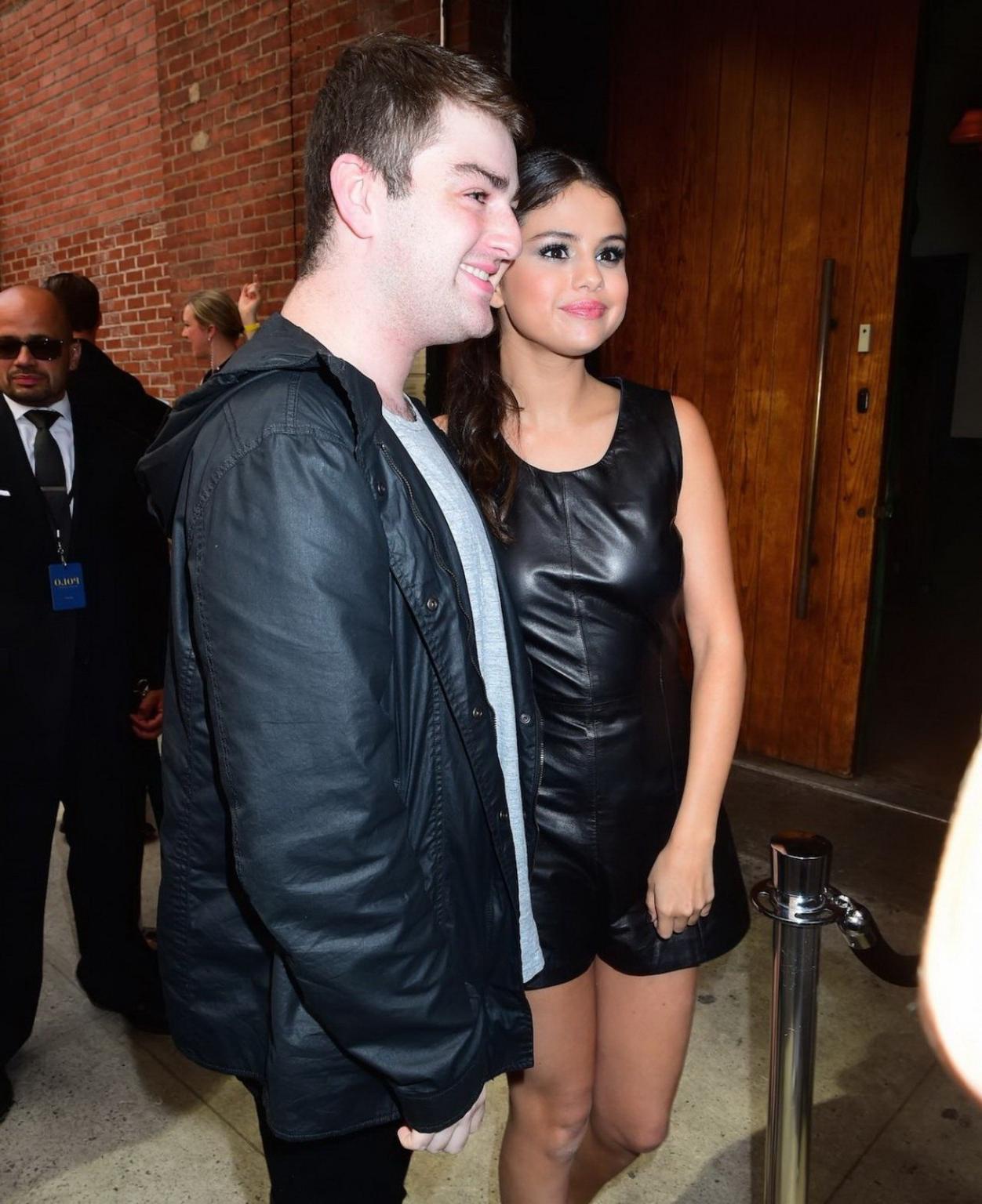 16P Selena Gomez showing nipple pokies in leather rompersuit